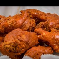 Wings · Our tasty, breaded, and fried chicken wings with a kick of spice.