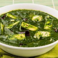 Palak Paneer · Healthy spinach cooked with cottage cheese delicately spiced.