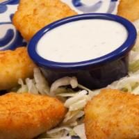 Jalapeño Poppers · Six jalapeños stuffed with cream cheese and served with ranch dressing.