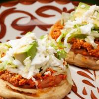 Sopes · New. Two thick corn masa tortilla with your choice of chorizo, al pastor or carne asada. Top...