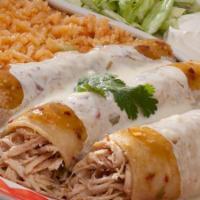 Enchiladas Suizas · Spicy. Three chicken enchiladas topped with cheese sauce, green salsa, and cilantro. Served ...