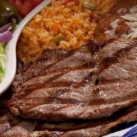 Carne Asada · Our grilled steak served with avocado, lettuce, tomato, jalapeño, red onions and served with...