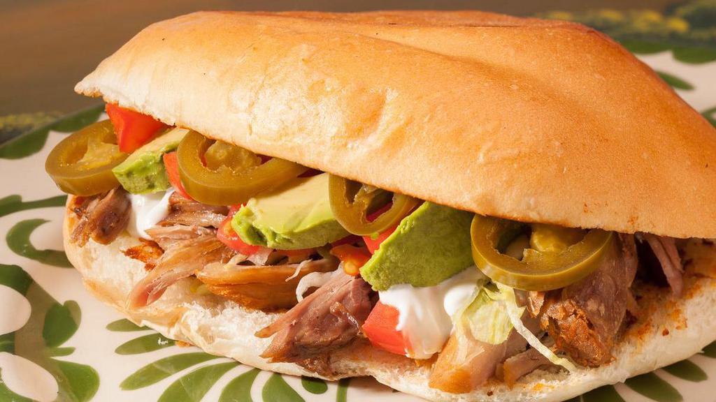 Torta · Mexican specialty sandwich filled with choice of carnitas, grilled steak, al pastor or grilled chicken, lettuce, tomate,jalapeno, avocado and sour cream.  Server in a warm Authentic Mexican Bread Roll with side of French Fries