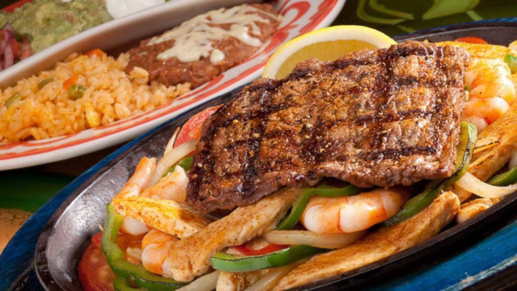 Fajita Ranchera For Dos · Steak, chicken, shrimp, and chorizo.