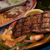 Especial De La Mesa For Uno · Chicken, shrimp and chorizo fajitas topped with carne asada.