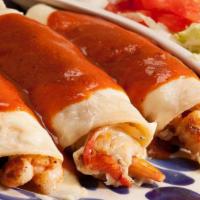 Enchiladas Acapulco · Three enchiladas filled with shrimp and crab, topped with melted cheese and sauce. Served wi...