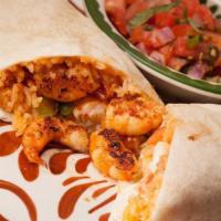 Burrito De Camaron · Grilled shrimp and vegetables wrapped in a flour tortilla with rice, lettuce and sour cream....