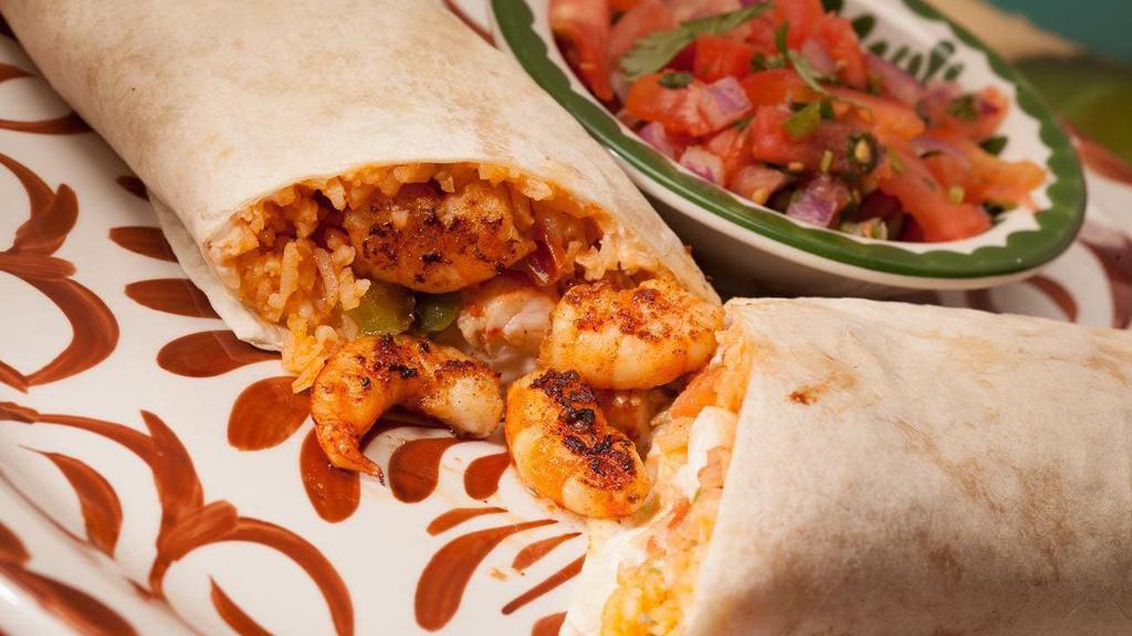 Burrito De Camaron · Grilled shrimp and vegetables wrapped in a flour tortilla with rice, lettuce and sour cream. Served with pico de gallo.