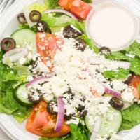 Greek Salad · Lettuce, tomato, cucumber, black olives, onions, Feta cheese, Greek dressing.