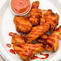 Buffalo Wings · Fried to a golden brown. These wings are served with barbecue sauce, ( 40 wings).