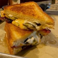 Jalapeno Popper Grilled Cheese · Texas toast, pickled jalapenos, cream cheese, bacon, Monterey Jack  cheese and cheddar chees...