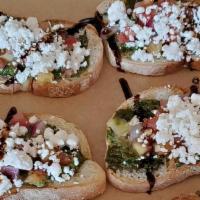 Goat Cheese Bruschetta · (6) Toasted French bread topped with basil pesto, goat cheese, and diced tomato. Topped with...