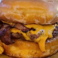The Wagon Wheel Burger · 1/2 lb porterhouse patty is fresh from the butcher. Topped with applewood bacon and cheddar ...