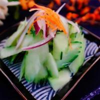 Cucumber Salad · Slices of fresh cucumber, carrot served with sweet and sour vinagrette