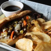 Italian Beef Sandwich · Carved prime rib, mild giardiniera peppers, provolone cheese, served with au jus on a hoagie...