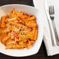 Mario’S Spicy Rigatoni · Tender chicken breast sautéed with garlic and red peppers, in a spicy tomato cream sauce.