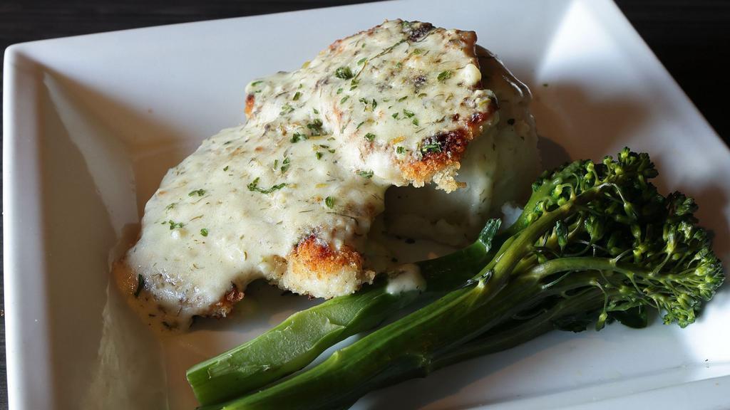 Lemon Dill Chicken · Lightly breaded chicken breast seared crisp and topped with a homemade lemon dill cream sauce.  Served with garlic mash potatoes and brocollini