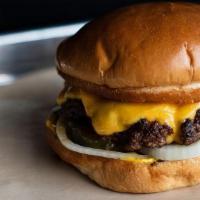 The Original · Single Beef Patty, American Cheese, Toasted Bun--- Served with mustard, onion and pickle
