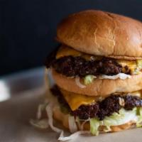 The Nation · 2 Beef Patties, American Cheese, Shredded Lettuce, Pickles, Onions, 1000 Island Dressing on ...