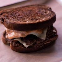 Patty Melt · Two All Beef Patties, 2 Slices of Swiss Cheese, Sautéed Mushrooms and Onions, Thousand Islan...