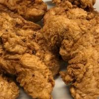 Chicken Tenders · Breaded and fried Chicken tenders, tossed in your choice of sauce. Choice of ranch or blue c...