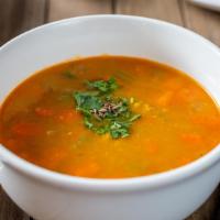 Lentil Dal Soup · Lentil soup with carrots, onions and celery, topped with roasted cumin and fresh chopped cil...