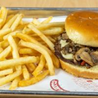 Swiss Mushroom Burger · Quarter pound all natural beef patty topped with sauteed grilled mushrooms and Swiss Cheese ...