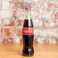 Mexican Coke · Mexican Coke, in a glass bottle.