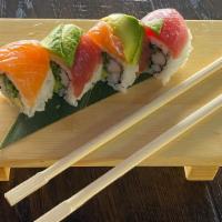 Rainbow · Cali roll topped w/ salmon, tuna, white tuna & avocado.