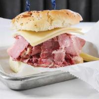 Headliner · Hot corned beef, melted Swiss cheese and mustard on an onion roll.