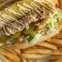 Shrimp Po Boy · Crispy shrimp po boy sandwich on fresh French bread, served with cajun fries or onion rings