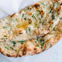 Garlic Naan By Mild 2 Spicy · By Mild 2 Spicy. Flat bread cooked with stuffed garlic and spices. Vegetarian. Contains glut...