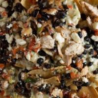 Espi-Nachos · Espinaca cheese sauce, topped with pico, black beans, queso fresco and black olives.  Served...