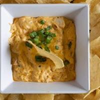 Buff Chicken Dip · This creamy dip is perfect for wing sauce lovers.  Topped with green onions.