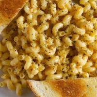 Mac 'N' Cheese · Creamy three cheese sauce with cavatappi pasta and toasted bread crumbs.  Served with Garlic...