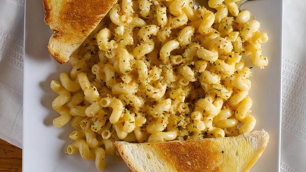 Mac 'N' Cheese · Creamy three cheese sauce with cavatappi pasta and toasted bread crumbs.  Served with Garlic Toast. 

Add grilled, fried, buffalo or wilson style chicken for $2.00