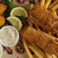 Fish 'N Chips · Pub battered fish fillets with “chips” from across the pond, hush puppies, slaw & Johnny’s t...