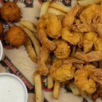 Shrimp Platter · 9 large shrimp with hush puppies, fries, coleslaw and cocktail sauce.  Your choice of fried,...