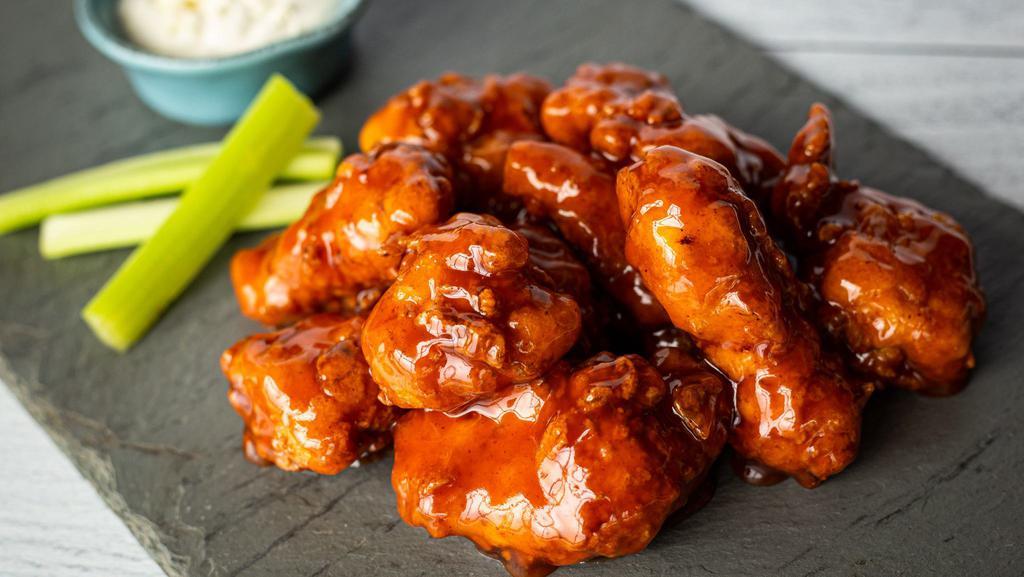 Boneless Wings · Hand-breaded & tossed in your choice of spicy Buffalo, cherry cola BBQ or sweet chili, served with crisp celery & bleu cheese dressing.
