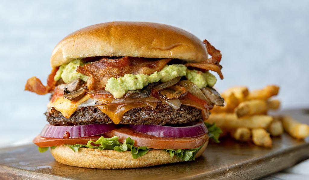 Garbage · Crisp smoked bacon, cheddar, Swiss, american, Mozzarella, sautéed mushrooms and onions, fresh guacamole and marinara. Served with lettuce, tomato and onion on a toasted brioche bun.