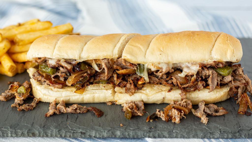 Philly Steak · Shaved steak, sautéed onions, green peppers and mushrooms with melted Mozzarella on a hoagie roll.