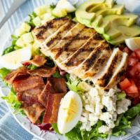 Avocado Cobb · Lemon-rosemary grilled chicken breast on a bed of crisp greens with fresh tomato, cucumber, ...