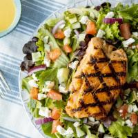 Mediterranean Salmon · Fresh greens tossed in house-made lemon-basil vinaigrette & topped with herb-grilled salmon,...