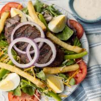 Pittsburgh Salad · Charbroiled sirloin strips & seasoned french fries over mixed greens, shredded jack & chedda...
