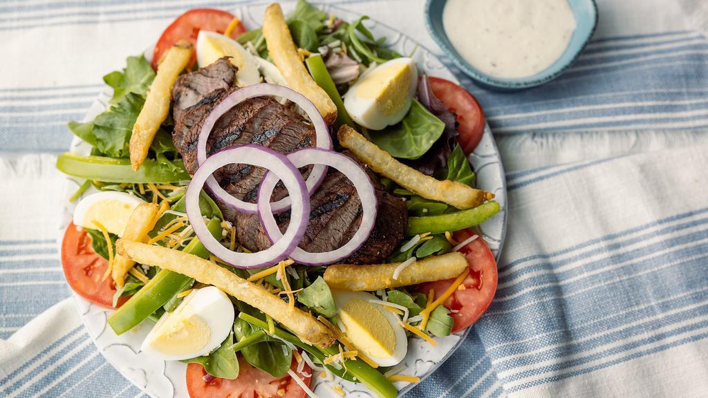 Pittsburgh Salad · Charbroiled sirloin strips & seasoned french fries over mixed greens, shredded jack & cheddar, sliced tomatoes, hard-boiled eggs, green bell peppers & red onions. Served with your choice of dressing.