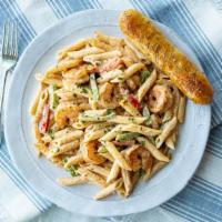 Cajun Alfredo Pasta · Onions and peppers sautéed with cajun spices tossed in a  creamy alfredo sauce and penne pas...