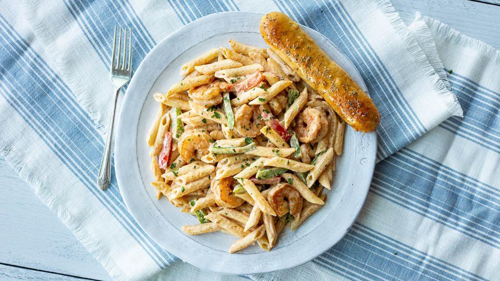 Cajun Alfredo Pasta · Onions and peppers sautéed with cajun spices tossed in a  creamy alfredo sauce and penne pasta. Served with a warm  garlic breadstick.