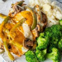 Smothered Chicken · Two juicy grilled chicken breasts topped with sautéed onions, mushrooms & green peppers then...