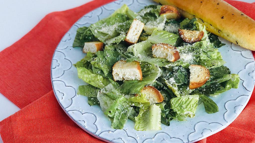 Side Caesar · Romaine, garlic croutons and Parmesan tossed in caesar dressing.