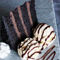 Chocolate Cake A La Mode · Moist multi-layer chocolate cake with decadent fudge icing topped with creamy vanilla ice cr...